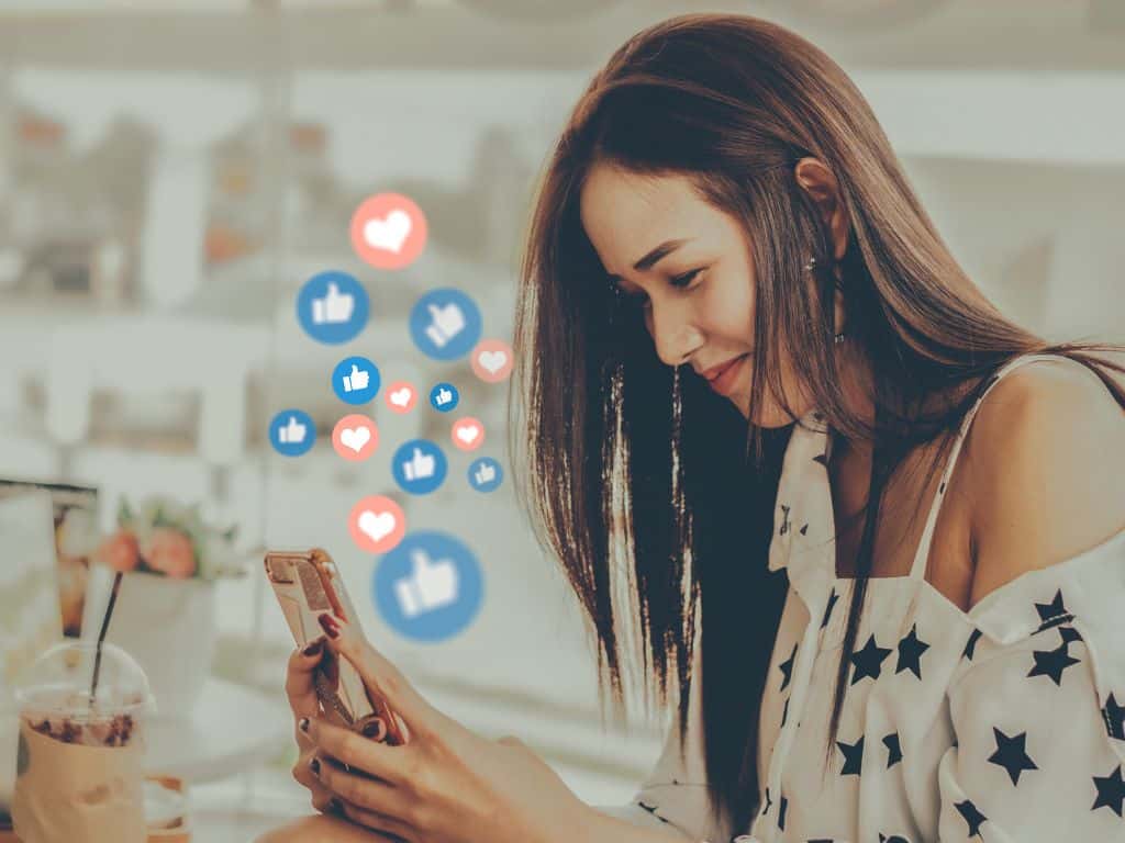 social media virtual assistant jobs: a lady on her social media