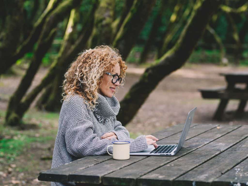 lady outdoors on her laptop
