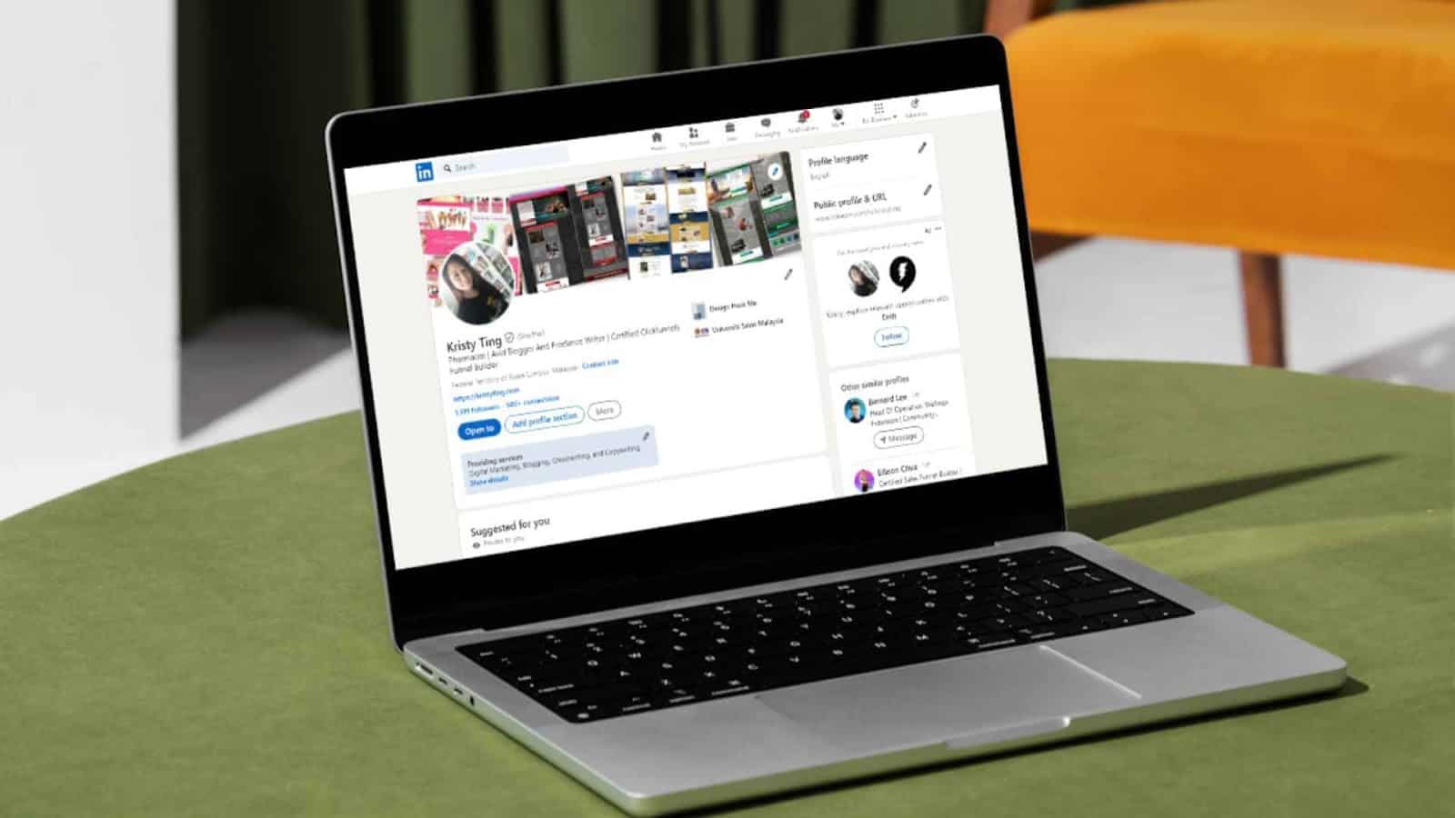 LinkedIn Photo - A laptop on a table displaying a LinkedIn profile page.