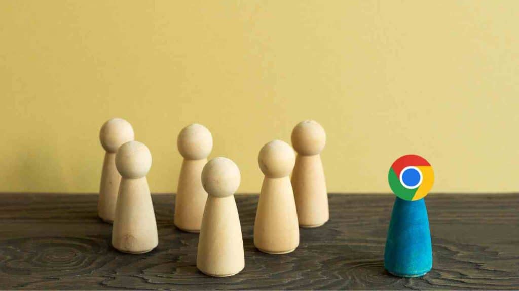 Wooden figurines with one figure representing Google Chrome leading others