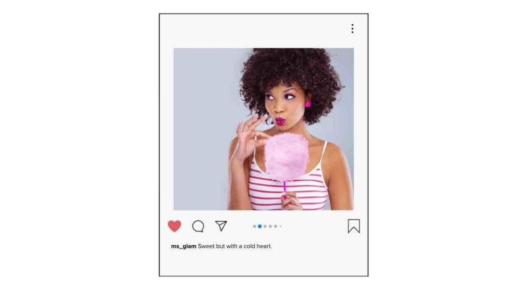 instagram baddie captions: Woman with curly hair eating cotton candy, looking playful.