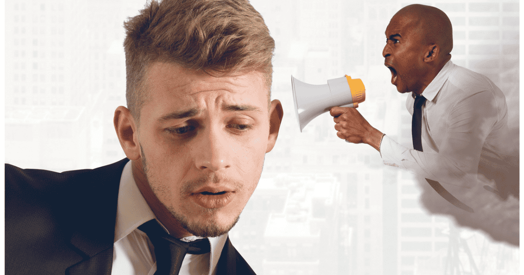 Client shouting through loudspeaker into man's ear