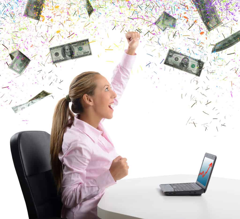 Woman sittin in front of her laptop making money online