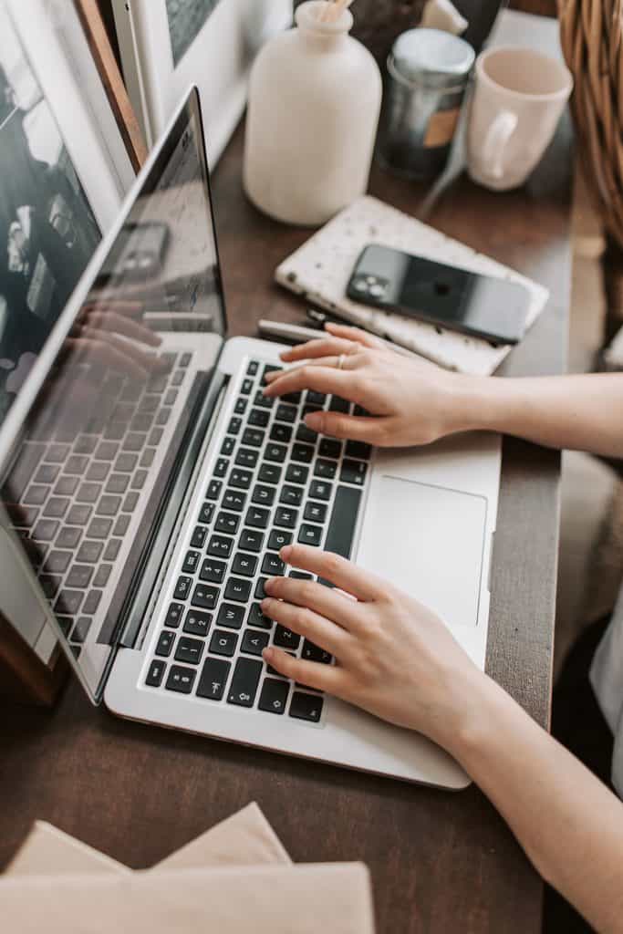 Freelancer working on a laptop while developing her digital skills