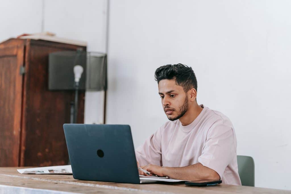 Freelancer working from home on a laptop, focused on client work when learning how to choose freelance skills