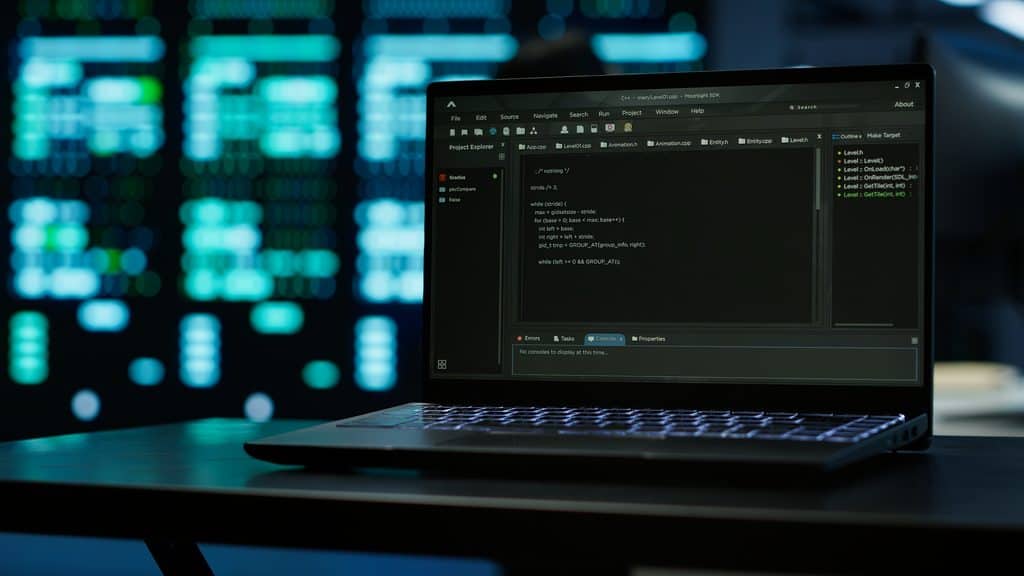 Laptop displaying C++ code in a development environment